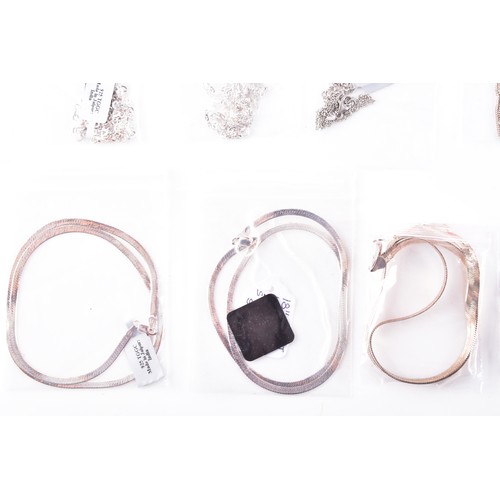 56 - A large collection of silver chains and bracelets, featuring an array of link styles and lengths, 24... 