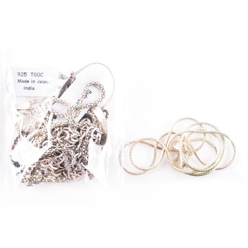 56 - A large collection of silver chains and bracelets, featuring an array of link styles and lengths, 24... 