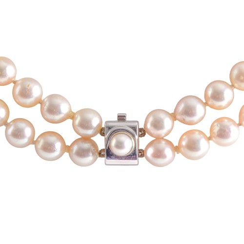 A double strand pearl necklace, the cultured pearls centred with a ...
