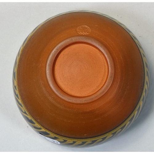 103 - Peter Dick (1936 - 2012), a small bowl with black and yellow sgraffito decoration, ochre coloured ba... 