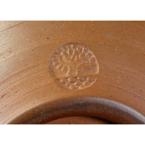 103 - Peter Dick (1936 - 2012), a small bowl with black and yellow sgraffito decoration, ochre coloured ba... 