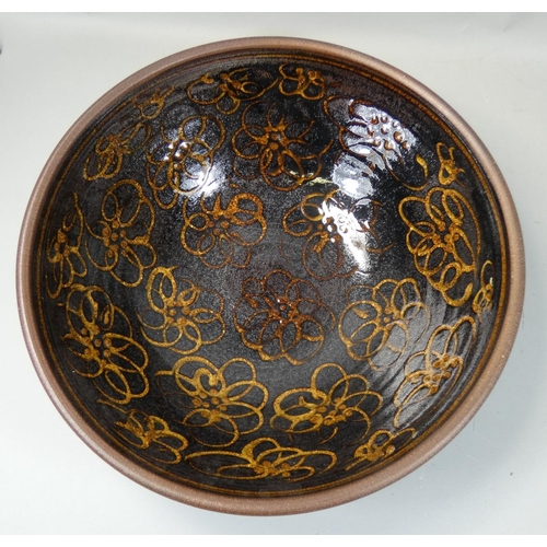 105 - Peter Dick (1936 - 2012), a large earthenware bowl for Coxwold Pottery, over glazed flower decoratio... 