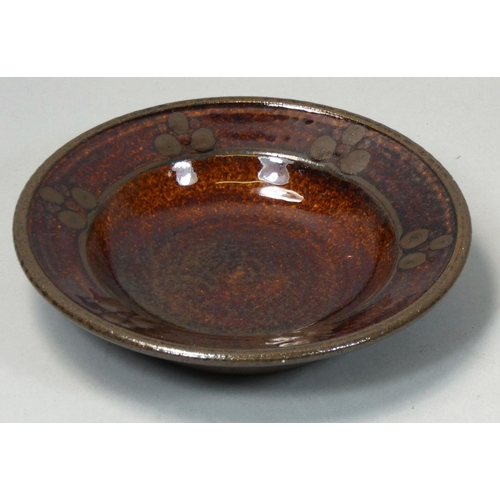 108 - Peter Dick (1936 - 2012), a small glazed dish, impressed mark to the base, diameter 15.5cm.