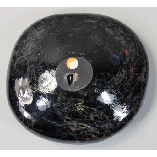 140 - Peter Layton (b.1937), a black and iridescent free blown pebble form, with etched makers name, dated... 