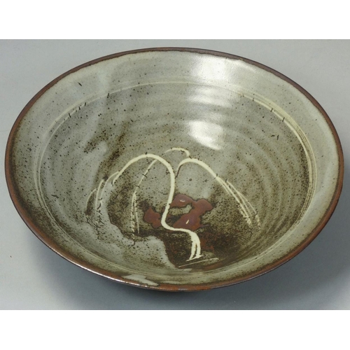 142 - David Leach OBE (1911 - 2005), a porcelain dish, rich tenmoku glaze with thick crawling white dolomi... 