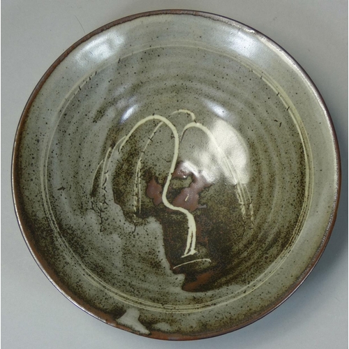 142 - David Leach OBE (1911 - 2005), a porcelain dish, rich tenmoku glaze with thick crawling white dolomi... 