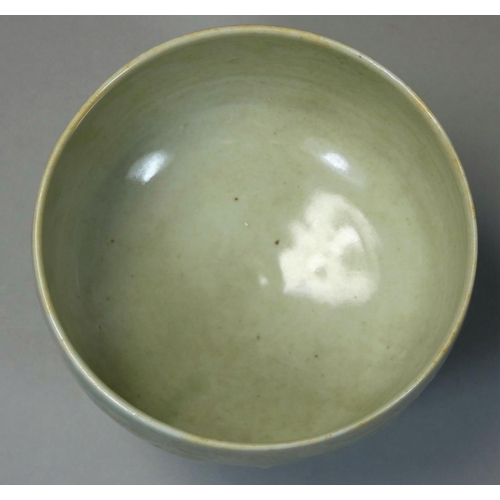 144 - David Leach OBE (1911 - 2005), a porcelain footed bowl, pale green celadon glaze, relief scroll deco... 