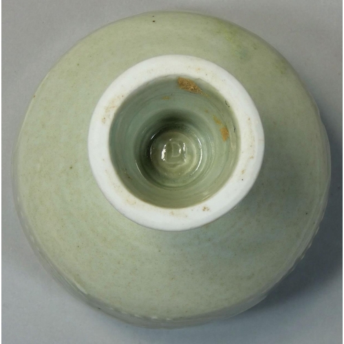 144 - David Leach OBE (1911 - 2005), a porcelain footed bowl, pale green celadon glaze, relief scroll deco... 