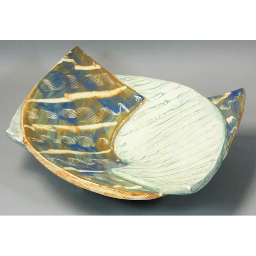 154 - Carol McNicoll (b.1943), an unusual split ceramic bowl, in the form of two interwoven arches, painte... 