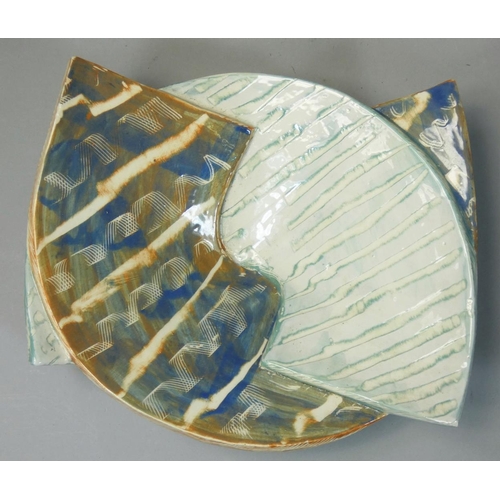 154 - Carol McNicoll (b.1943), an unusual split ceramic bowl, in the form of two interwoven arches, painte... 