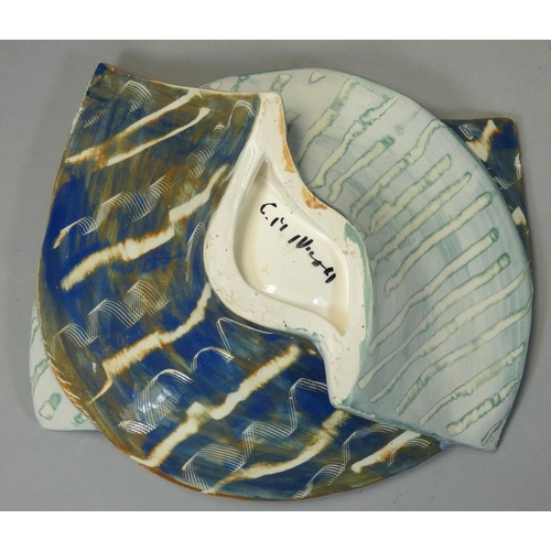 154 - Carol McNicoll (b.1943), an unusual split ceramic bowl, in the form of two interwoven arches, painte... 