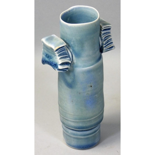 173 - Colin Pearson (1923 - 2007), a porcelain winged cylinder vase with two applied wings, covered to the... 