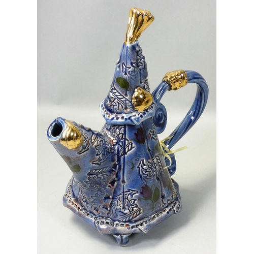 174 - Philomena Pretsell (b.1951), an unusual blue glazed teapot, with painted and incised floral decorati... 