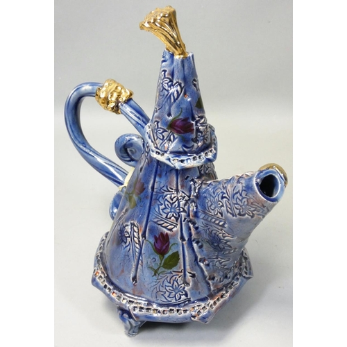 174 - Philomena Pretsell (b.1951), an unusual blue glazed teapot, with painted and incised floral decorati... 