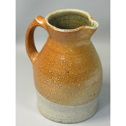 185 - Sarah Walton (b.1945), an ochre glazed stoneware jug, with speckle pattern design, initialled 'SW' t... 