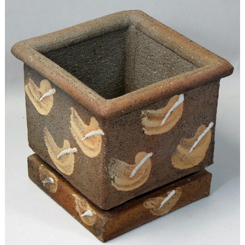 45 - A stoneware planter with water reservoir, of square form with applied decoration, height 15cm.