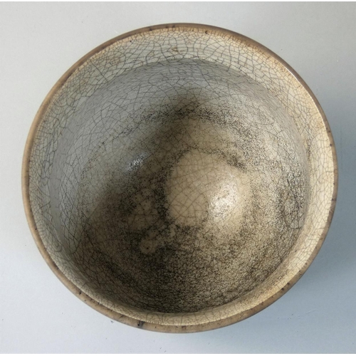 50 - Tim Andrews (b.1960), a stoneware Raku fired deep bowl with a crackle glazed interior, abstract desi... 