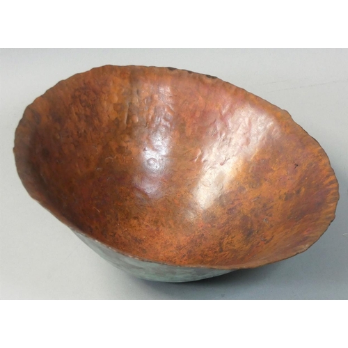 53 - Roger Barns, three graduated patinated and hammered copper bowls, together with three wooden stands,... 