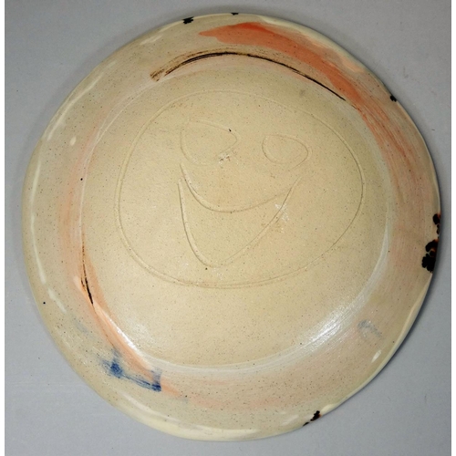 85 - Sandy Brown (b.1946), a circular plate with bold brushwork and trailed decoration, signed to the fac... 