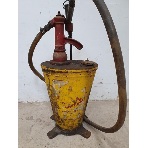 69 - A vintage hand oil dispenser, in Shell colours, height 70 cm.