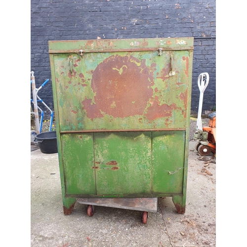 74 - A vintage oil dispenser cabinet, painted in Castrol colours, the sliding door opening to reveal thre... 