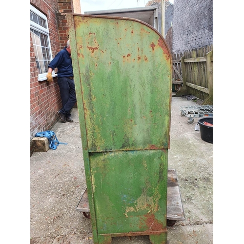 74 - A vintage oil dispenser cabinet, painted in Castrol colours, the sliding door opening to reveal thre... 