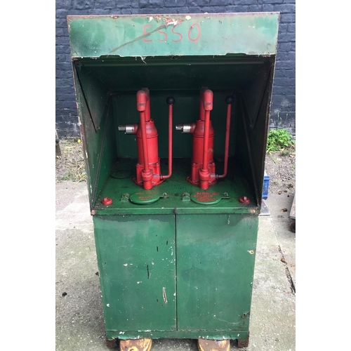 75 - A vintage oil dispenser cabinet, painted in Castrol colours, the sliding door opening to reveal two ... 