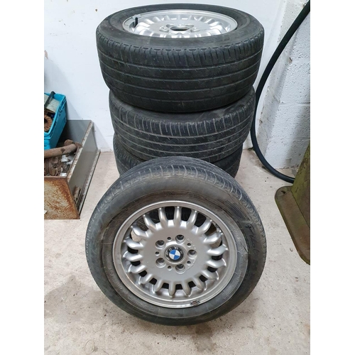 92 - A set of five BMW alloy wheels, 7G x 15 part no 110069/1 with worn tyres