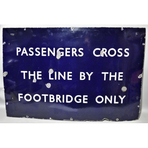 70 - A vitreous enamel, single sided, wall mounted railway sign, 'Passengers cross the line by the footbr... 