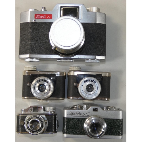 101 - A collection of sub-miniature cameras, to include a Meopta Mikrona II in green covering, two Kunik P... 