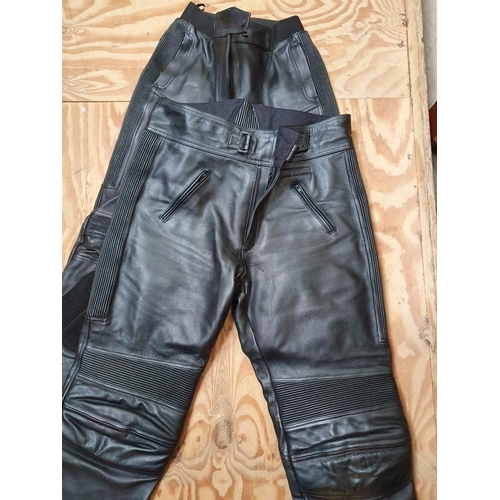 24 - A pair of Belstaff black leather trousers, size 16 and a pair of Frank Thomas black leather trousers... 