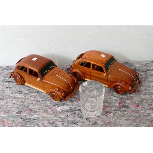 44 - Two wooden models of a VW Beetle, together with a Silverstone Classic presentation glass (3).