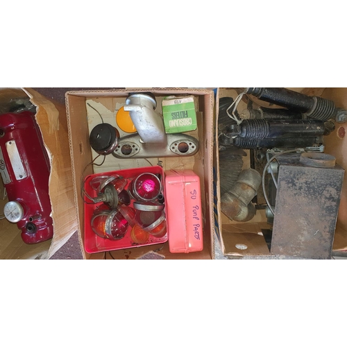 70 - A quantity of used MG ZB car spares, including lenses, a rocker cover and a manifold.