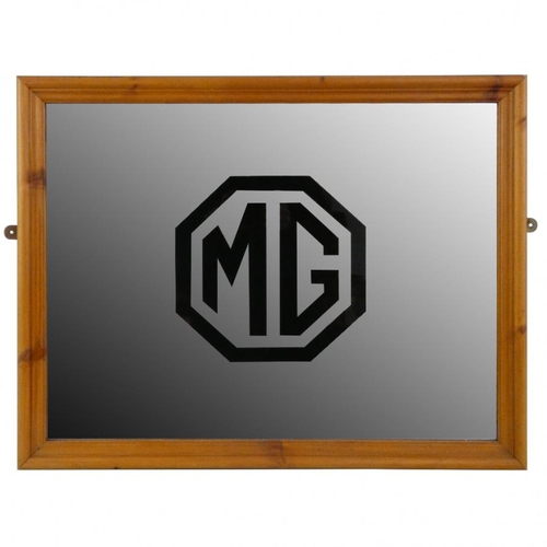 9 - *An MG mirror, later pine frame, 45 x 55 cm. Purchased from the Abingdon Road closure auction in the... 