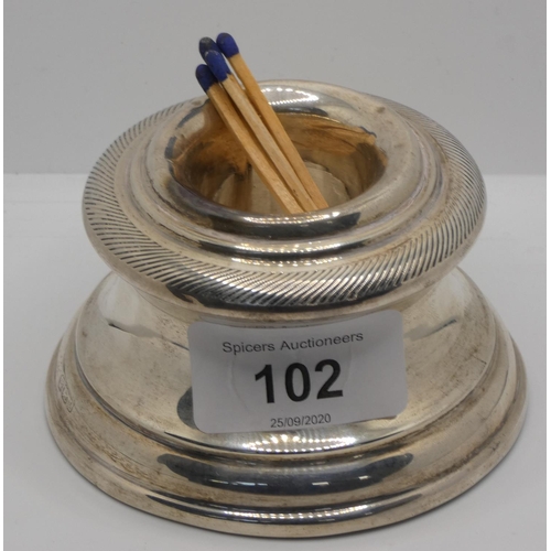 102 - A silver match holder, Sheffield, date letter worn, in the form of a capstan, loaded