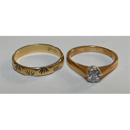 144 - An 18ct gold single stone diamond ring and a 18ct gold wedding band, 5.5 grams.