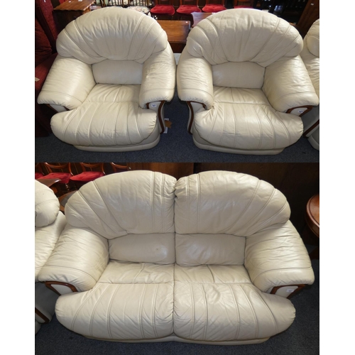 167 - A cream leather 3 piece suite comprising 2 seater settee aprox 155 cm wide together with a 2 arm cha... 