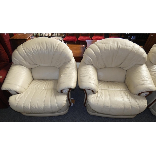 167 - A cream leather 3 piece suite comprising 2 seater settee aprox 155 cm wide together with a 2 arm cha... 
