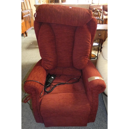 168 - An electric reclining armchair in red fabric.