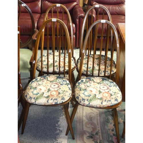179 - A set of four Ercol Quaker dining chairs with loose press stud seat covers (4).