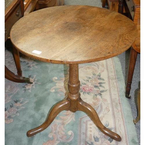 182 - A panelled oak coffer 128 cm wide x 76 cm tall x 47 cm deep, together with an oak circular tilt top ... 