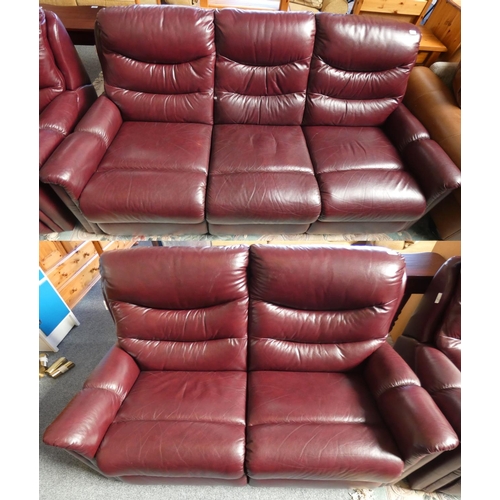 183 - A lazyboy 3 seater settee approx 195 cm wide in wine red leather, together with a matching 2 seater ... 