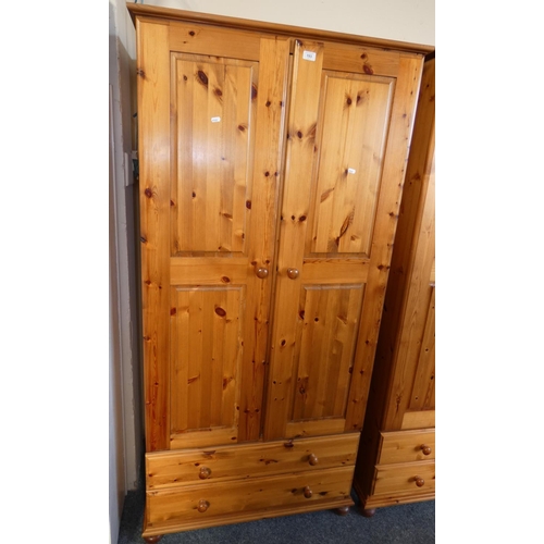 193 - A pine hanging wardrobe over 2 drawers approx 90 cm wide x 188 cm tall x 58 cm deep.