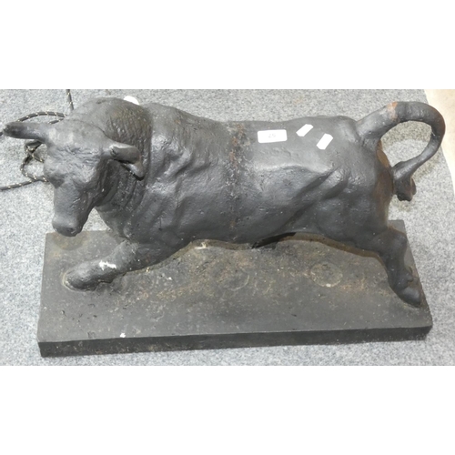 57 - A painted cast metal model of a bull, 59cm long.