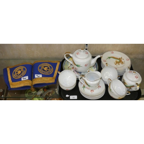 74 - A Kutani tea service, with a pair of riding cuffs.