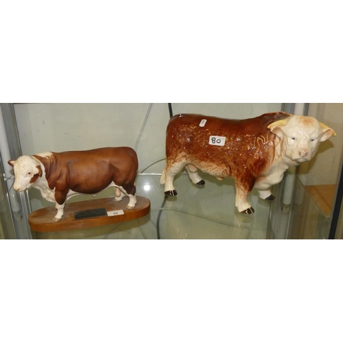 80 - A Beswick pulled Hereford bull on a wooden base (Connoisseur collection) together with a Melba ware ... 
