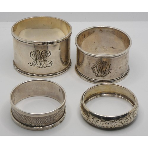 136 - Four silver napkin rings, a silver inkwell and other silver wares.