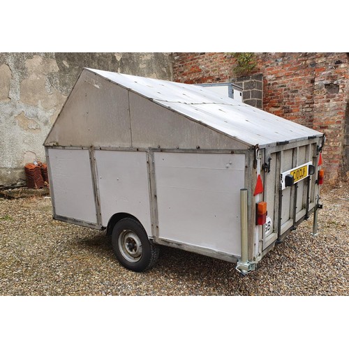 72 - A coach-built motorcycle enclosed trailer, the hinged lid opening to reveal three-wheel holders, for... 