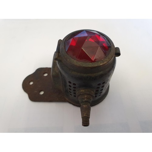 84 - A Miller vintage motorcycle stop/number plate carbide lamp, with facetted red glass.