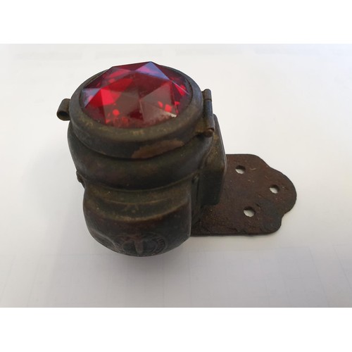 84 - A Miller vintage motorcycle stop/number plate carbide lamp, with facetted red glass.